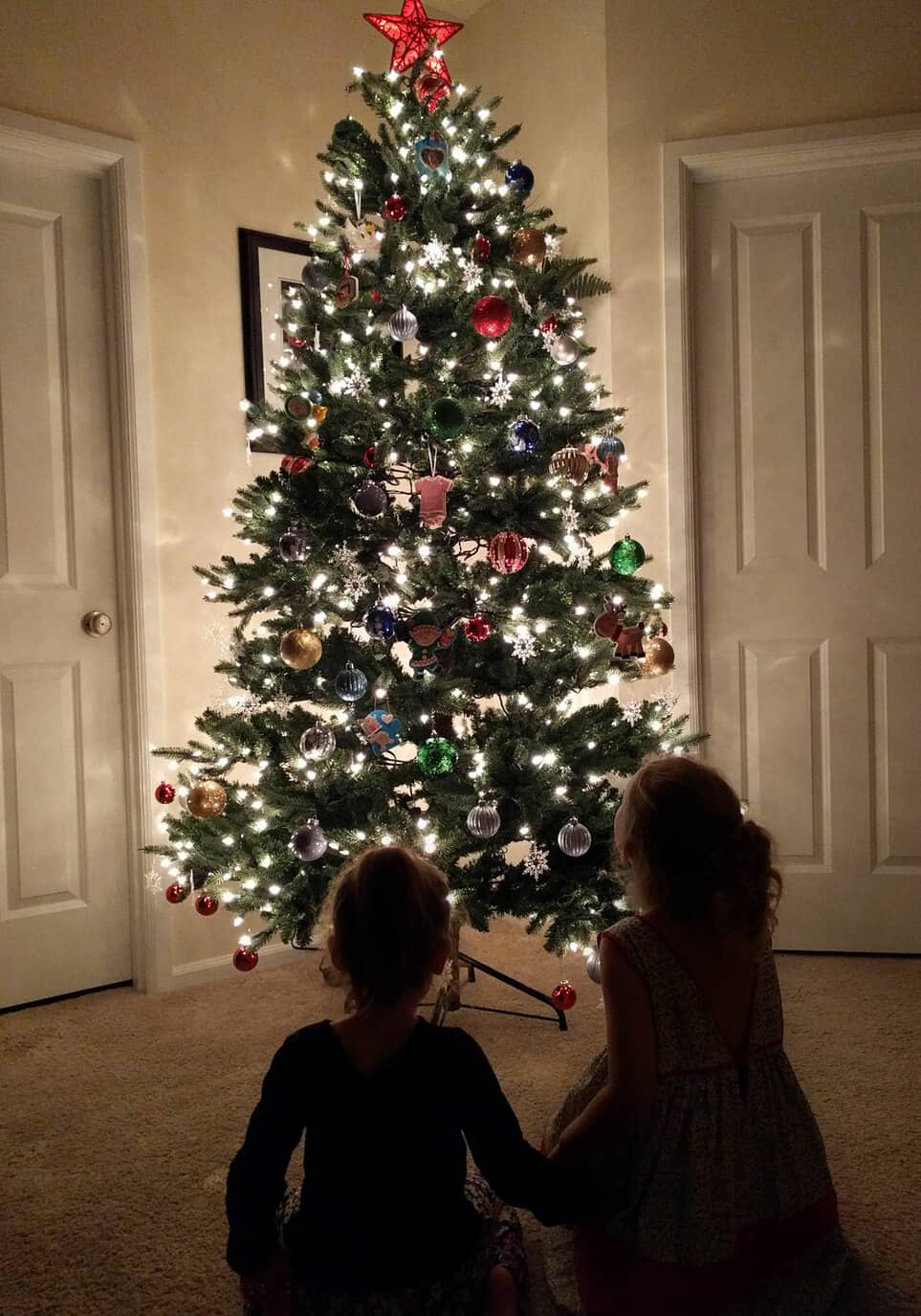 Christmas Tree Silhouette with Two Girls in Front